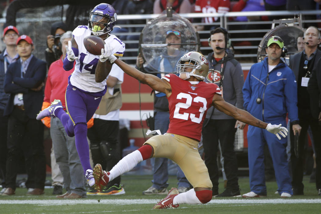 In this Jan. 11, 2020, file photo, Minnesota Vikings wide receiver Stefon Diggs (14) catches a ...