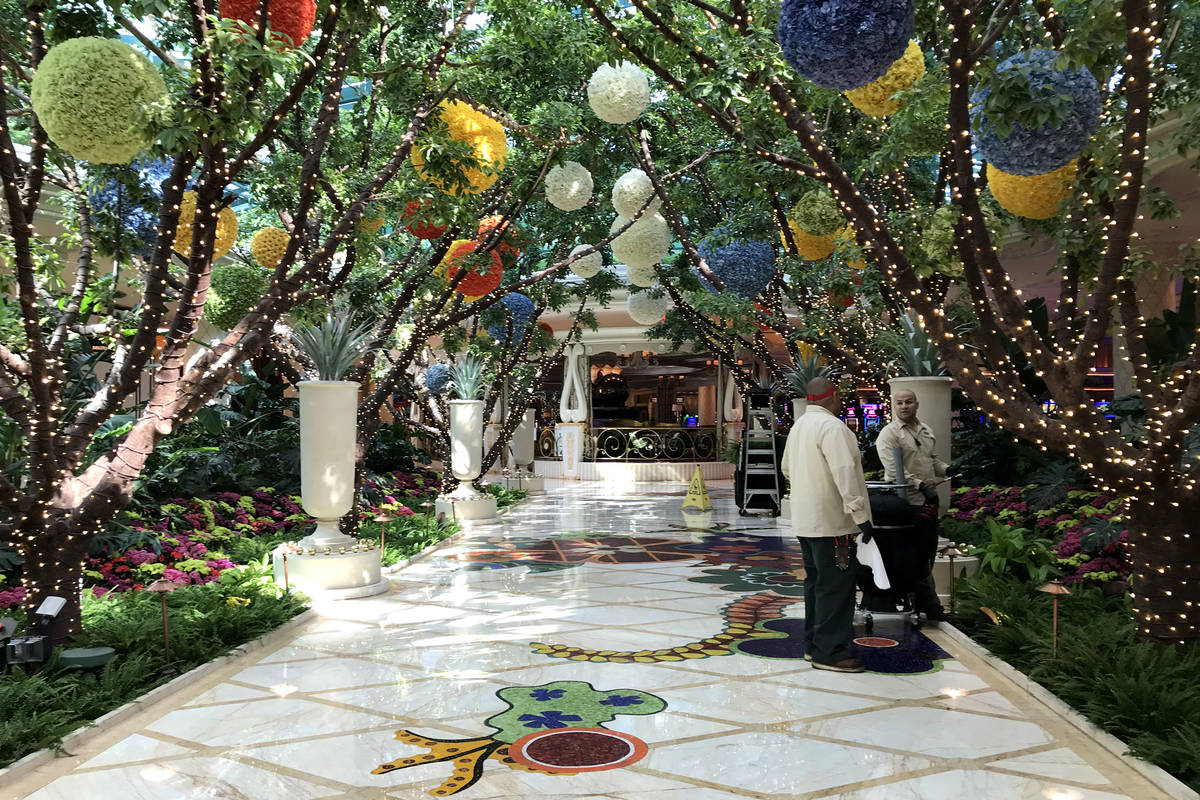 Employees at the Wynn, which will cease all operations by 6 p.m., tend to gardens on Tuesday, M ...