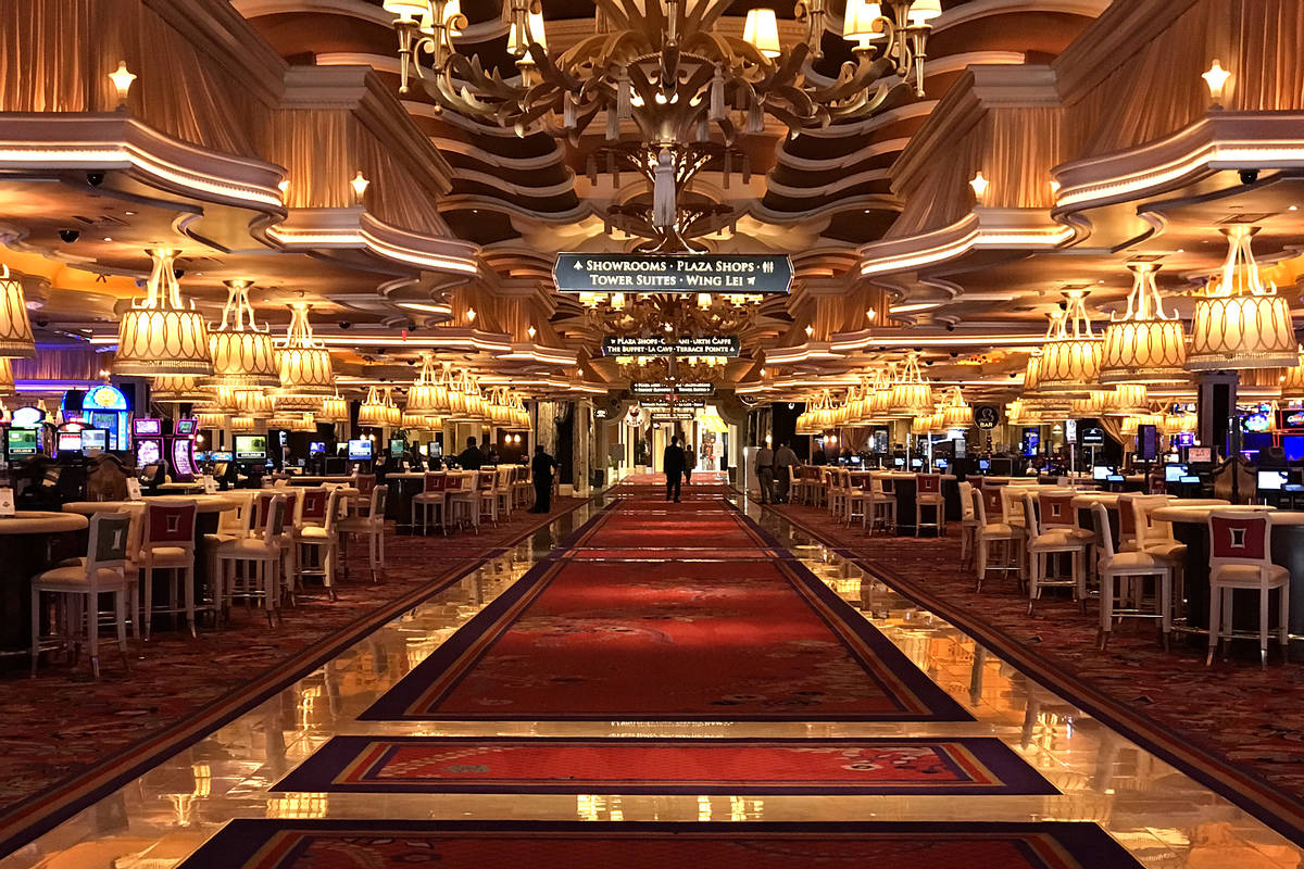 The Wynn's casino floor is empty but for employees on Tuesday, March 17, 2020, in Las Vegas. (E ...