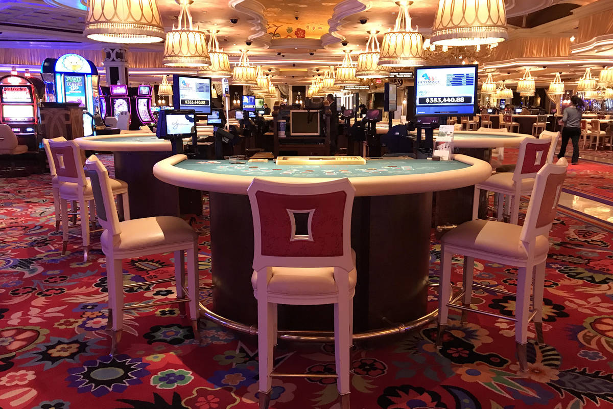 Chairs at blackjack tables at the Wynn are three to a table due to distancing between people to ...