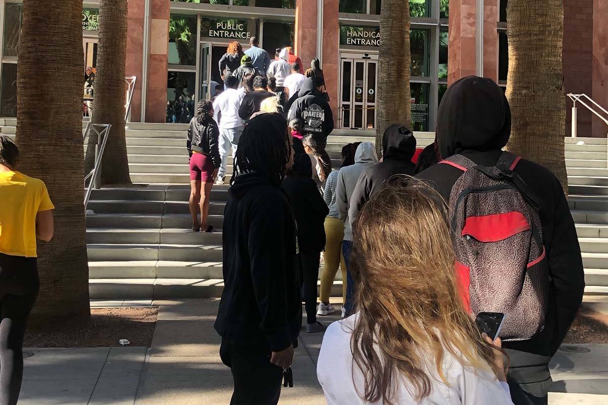 A line forms outside the Regional Justice Center on Tuesday March 17, 2020, as a result of a co ...
