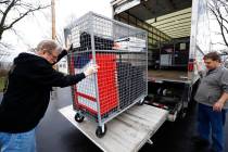 Voting machines are collected from a polling place at Our Lady of Lourdes church in Wintersvill ...