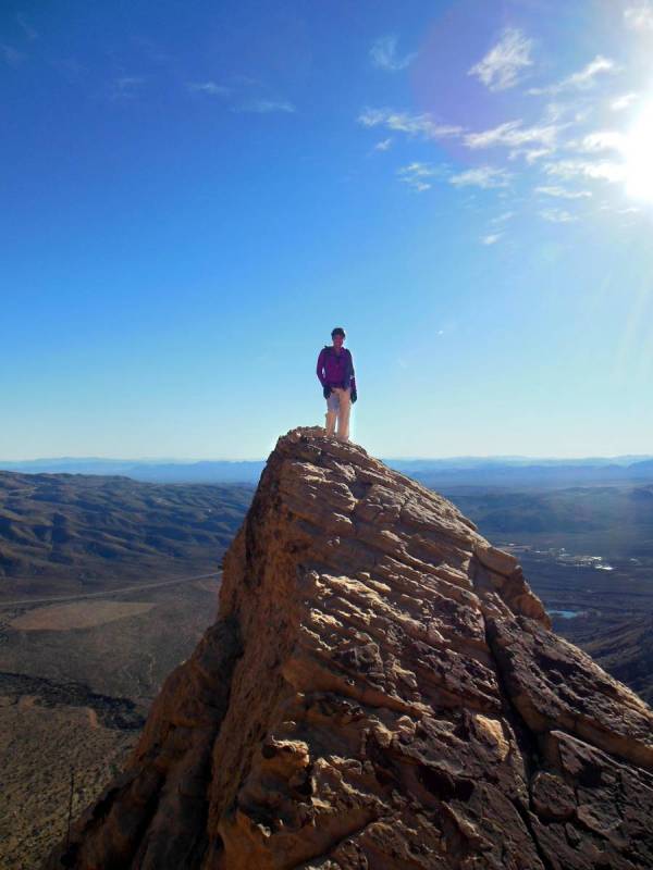 Tee Gammon stands on top of White Rock Pinnacle, also knows as White Pinnacle Peak, in Red Rock ...