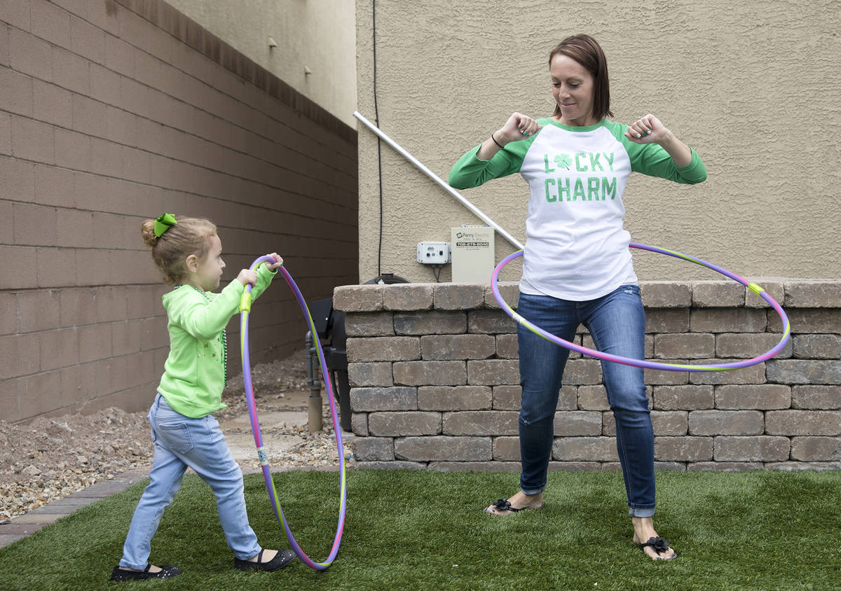 Angie Doleshal, 3, left, plays with her mother Maria Doleshal, right, at their home in Henderso ...