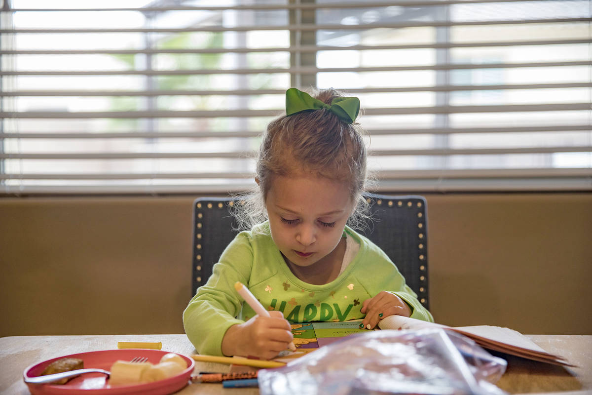 Angie Doleshal, 3, colors at her home in Henderson, Tuesday, March 17, 2020. Clark County Schoo ...