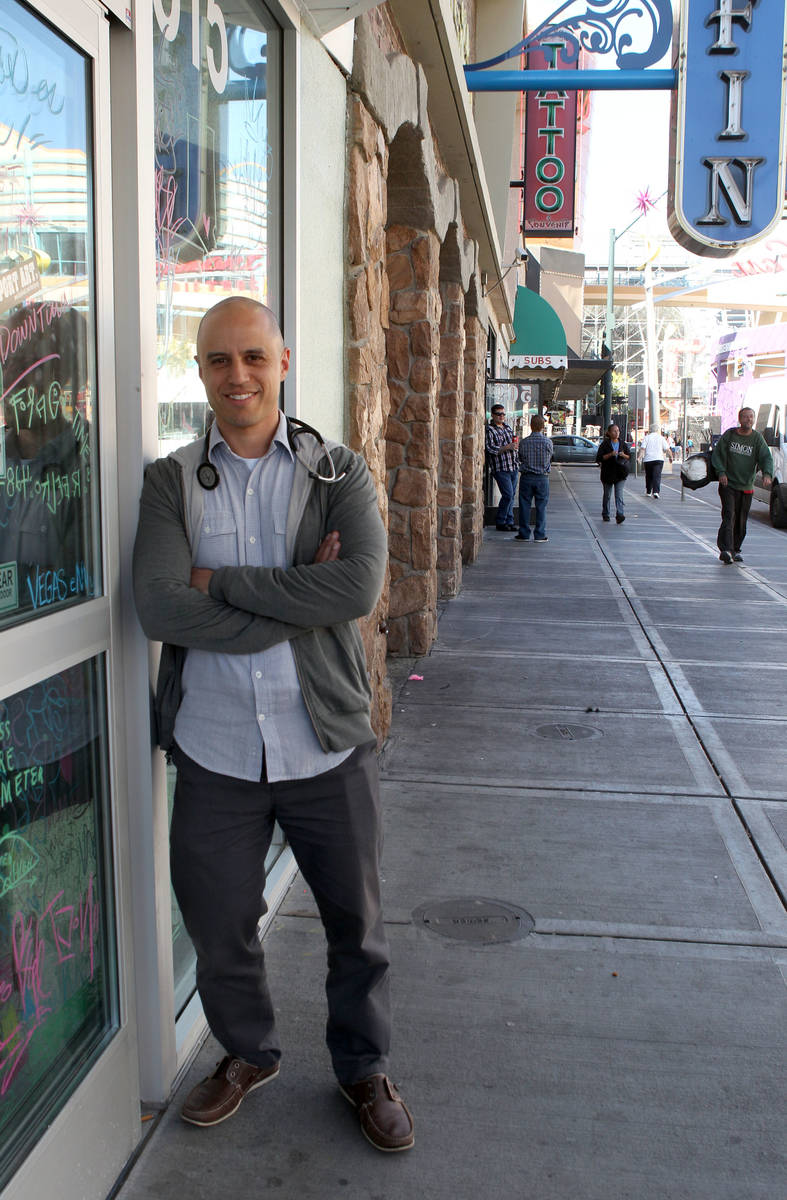 Zubin Damania, the Downtown Doc, poses for a photo on Fremont Street in downtown Las Vegas, Mon ...