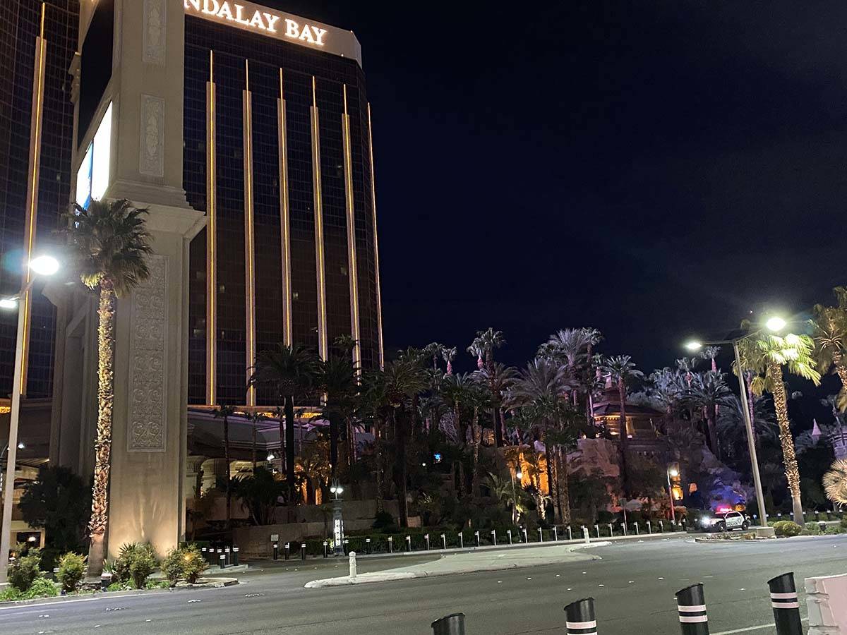 Police sit outside Mandalay Bay, which closed its doors Tuesday amid the coronavirus outbreak. ...