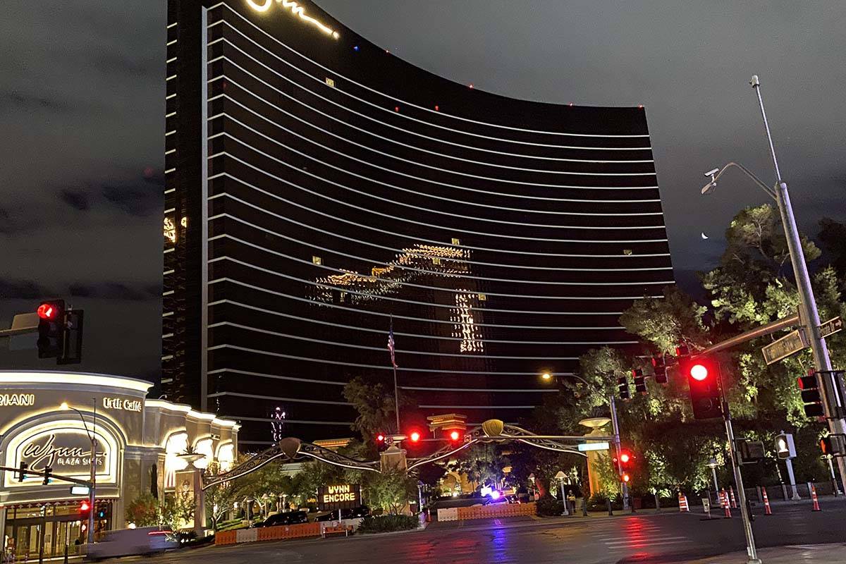 Police sit outside Wynn Las Vegas, which closed its doors Tuesday amid the coronavirus outbreak ...