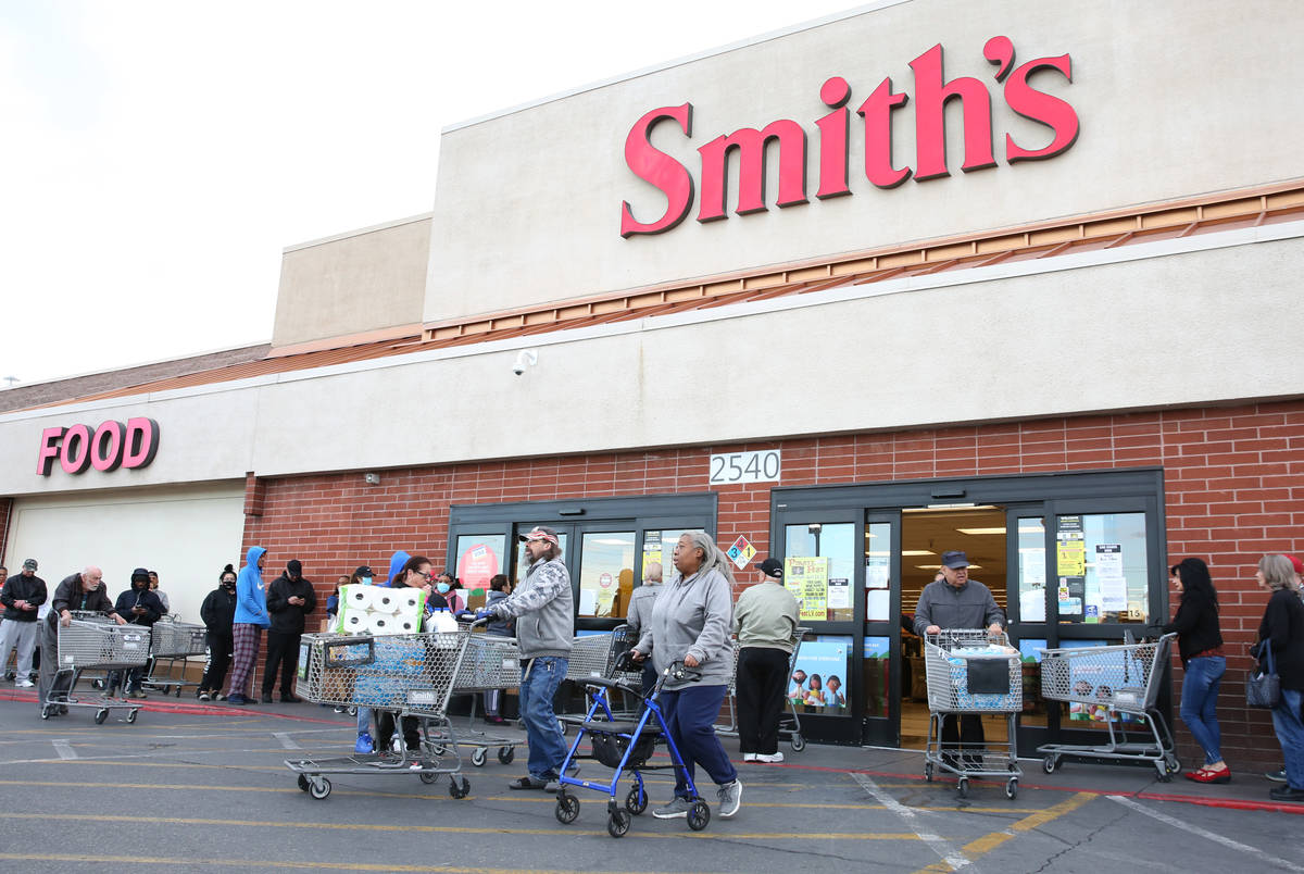 Seniors line up outside a Smith's store on Maryland Parkway on Wednesday, March 18, 2020, in La ...