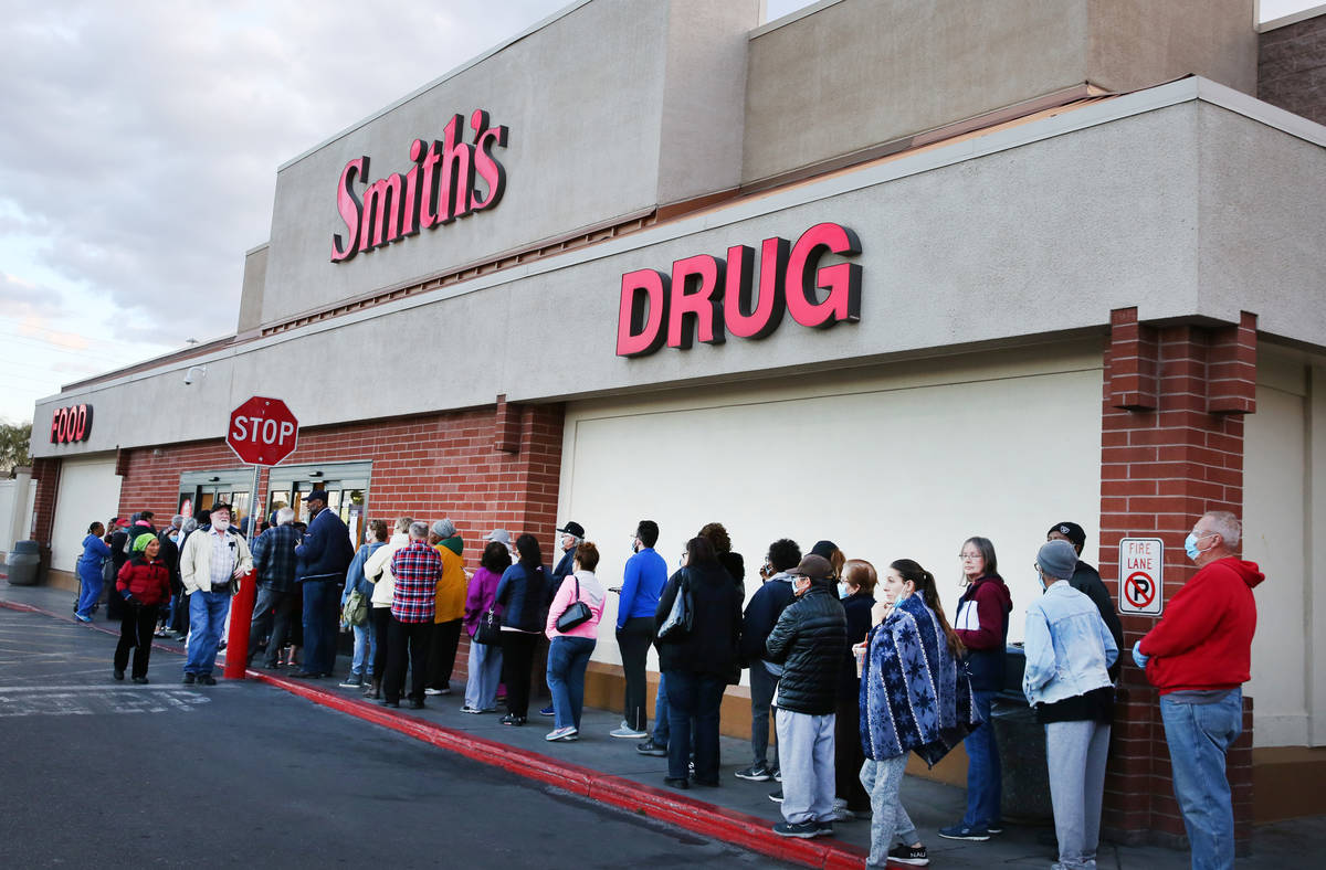 Seniors line up outside a Smith's store on Maryland Parkway on Wednesday, March 18, 2020, in La ...