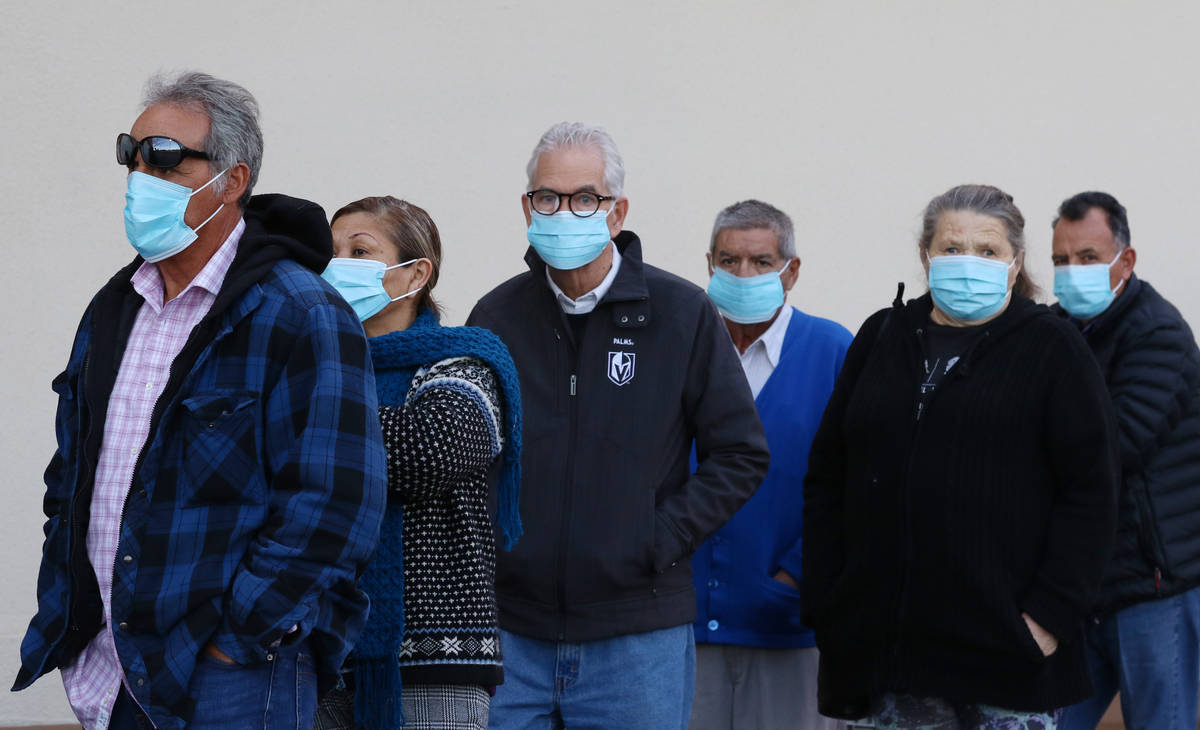 Seniors line up outside a Smith's store on Maryland Parkway on Wednesday, March 18, 2020, in La ...