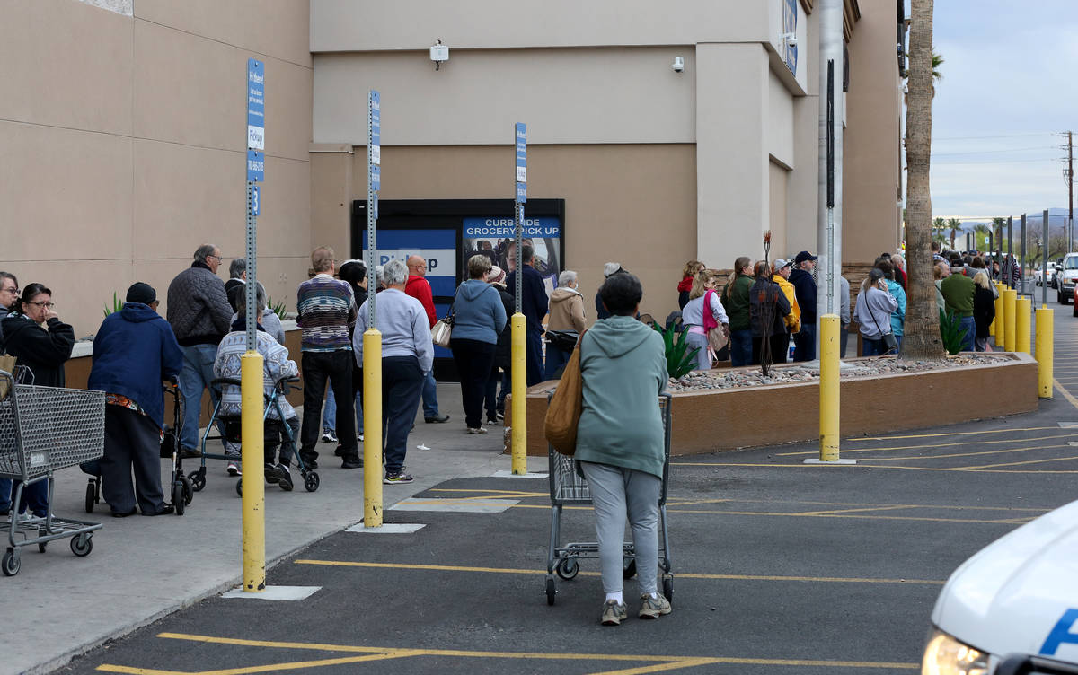 Seniors over 60 line up outside of Smith's in Henderson to get into the grocery store early on ...