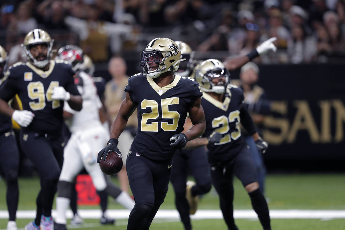 New Orleans Saints cornerback Eli Apple (25) holds the football after an interception that was ...