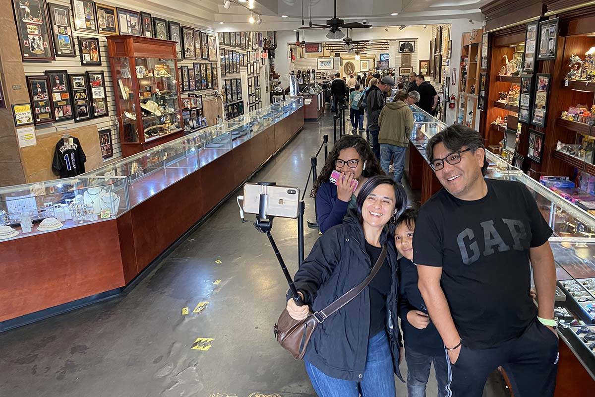 Salvador Enriquez takes a photo at noon Wednesday, March 18, 2020, with his wife, Nallely, daug ...