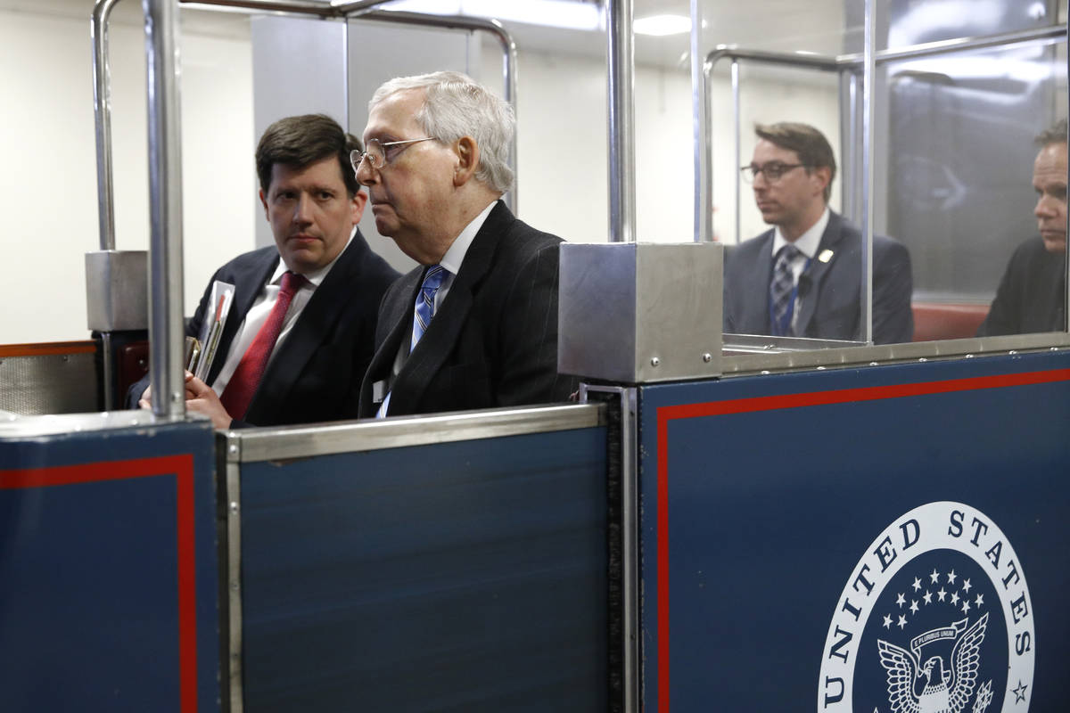 Senate Majority Leader Mitch McConnell of Ky., rides a subway car on Capitol Hill in Washington ...