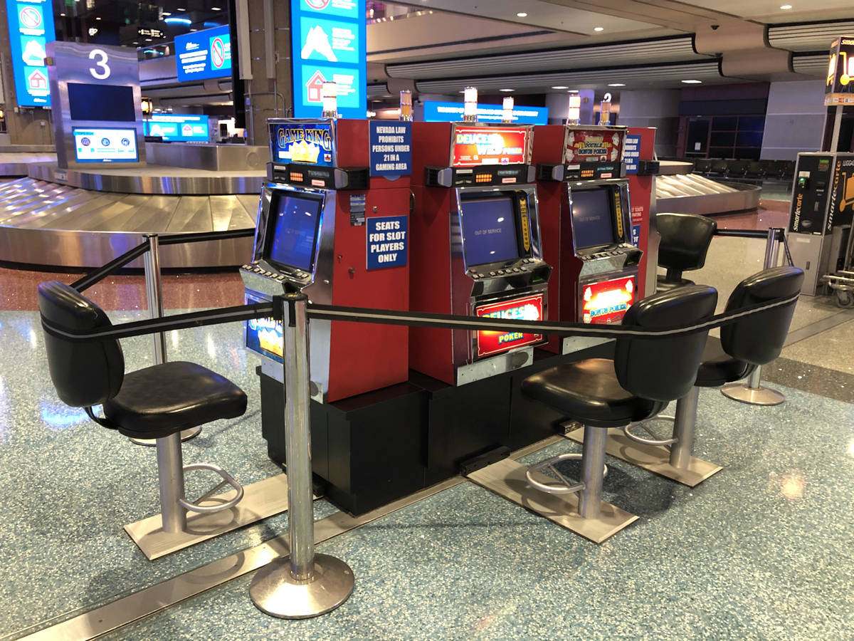 Slot machines at McCarran International Airport were roped off Wednesday, March 18, 2020, night ...