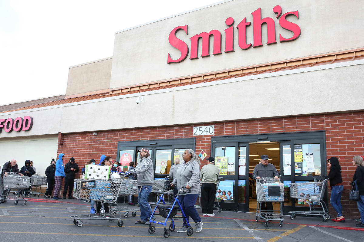 Seniors line up outside a Smith's store on Maryland Parkway on Wednesday, March 18, 2020, in La ...