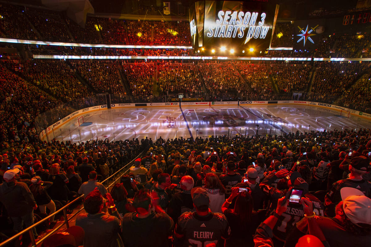 Season 3 starts sign above the crowd and on the ice before the start of the first period of the ...