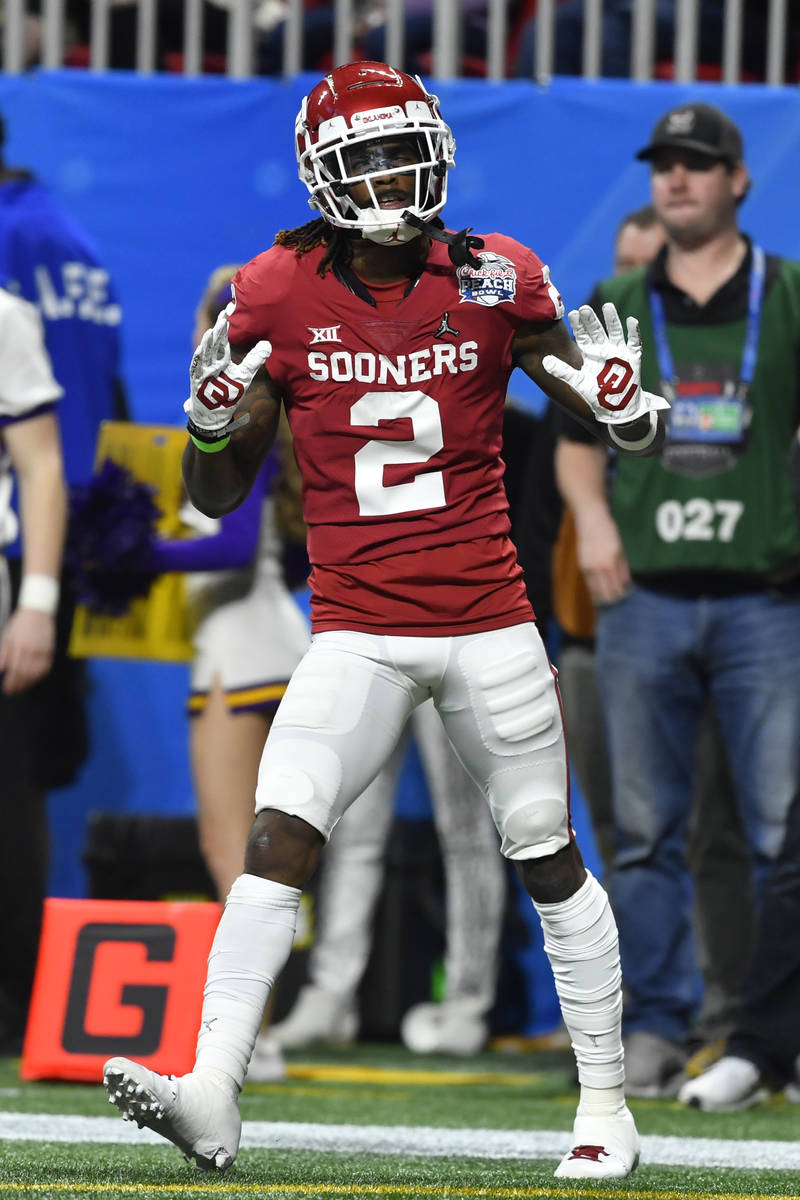 Oklahoma wide receiver CeeDee Lamb (2) celebrates a touchdown against LSU during the first half ...