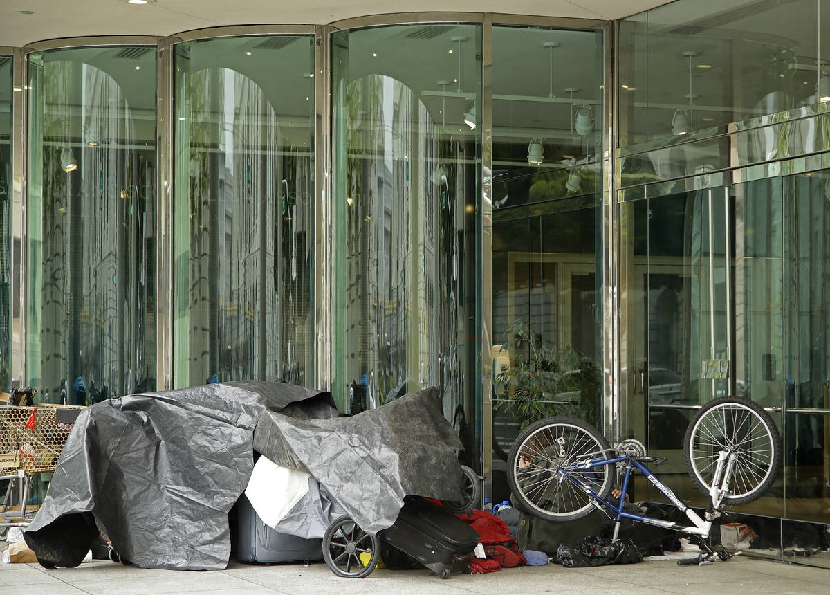 Homeless people camp out in from of the San Francisco Ballet Wednesday, March 18, 2020, in San ...