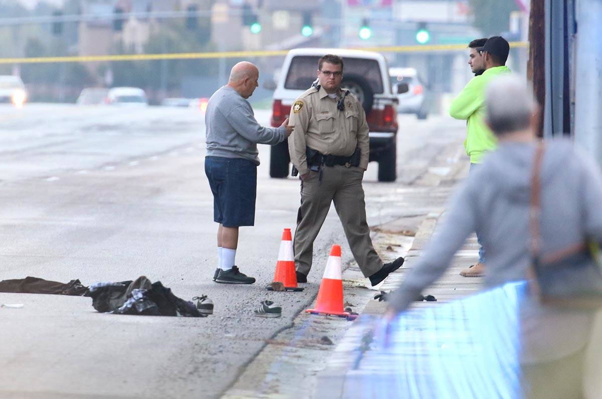 Las Vegas Metropolitan Police Department officers investigating after two male pedestrians were ...