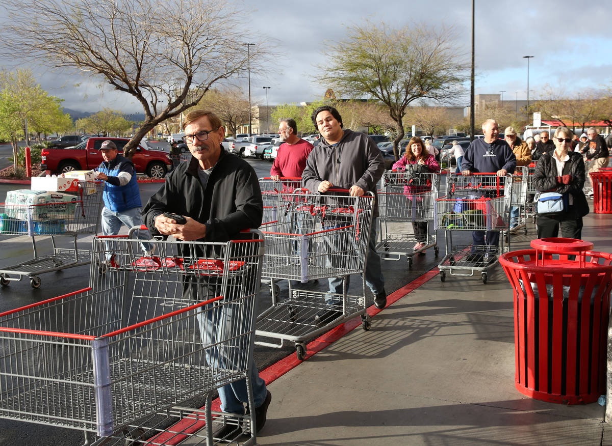 Seniors line up outside Costco on Friday, March 20, 2020, in Henderson. The store reserved earl ...