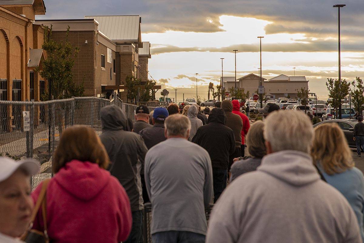 Seniors line up outside of a Smith's Marketplace located at 9710 West Skye Canyon Park Drive in ...