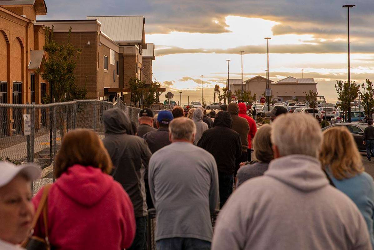 Seniors line up outside of a Smith's Marketplace located at 9710 West Skye Canyon Park Drive in ...