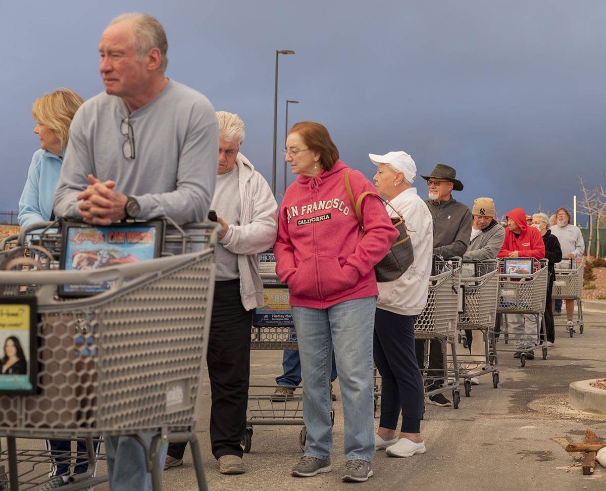 Seniors line up outside of a Smith's Marketplace located at 9710 West Skye Canyon Park Drive in ...