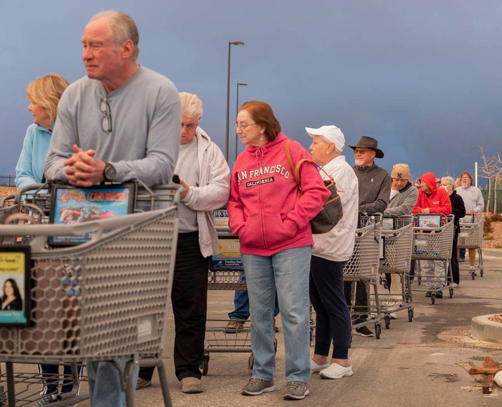 Seniors line up outside of a Smith's Marketplace located at 9710 West Skye Canyon Park Drive in ...