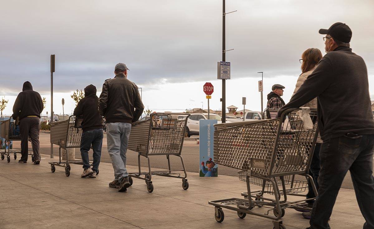 Seniors line up outside of a Smith's Marketplace located at 9710 West Skye Canyon Park Drive in ...