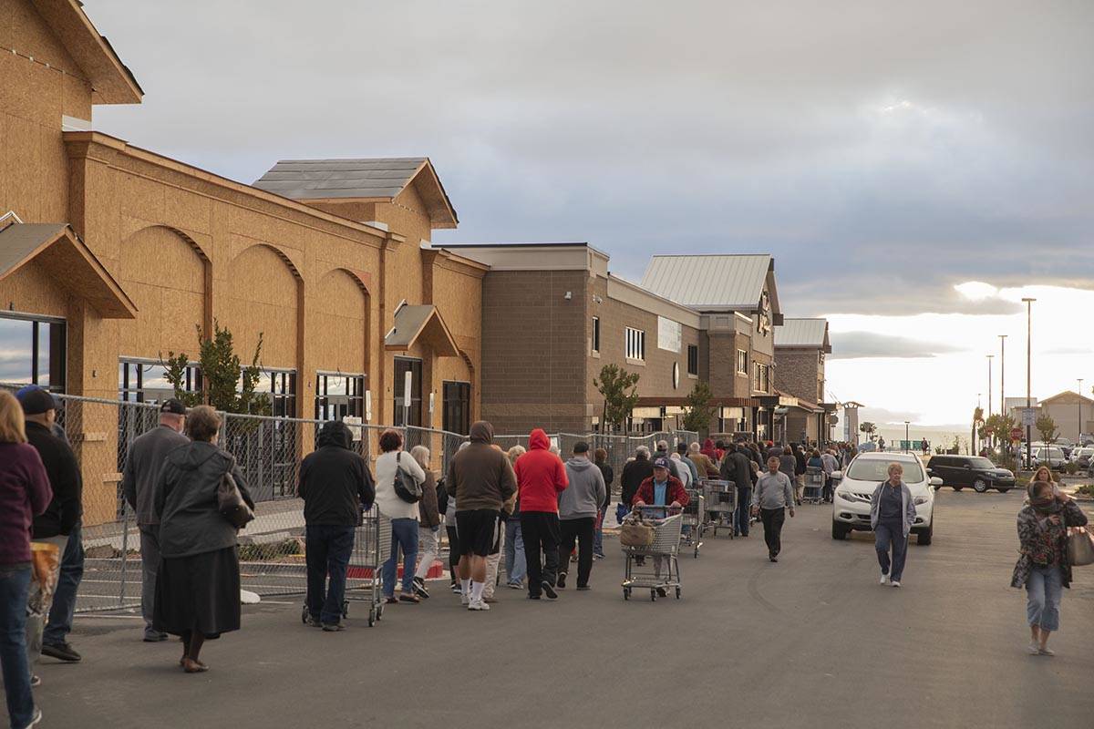 Seniors line up outside of a Smith's Marketplace located at 9710 West Skye Canyon Park Drive in ...