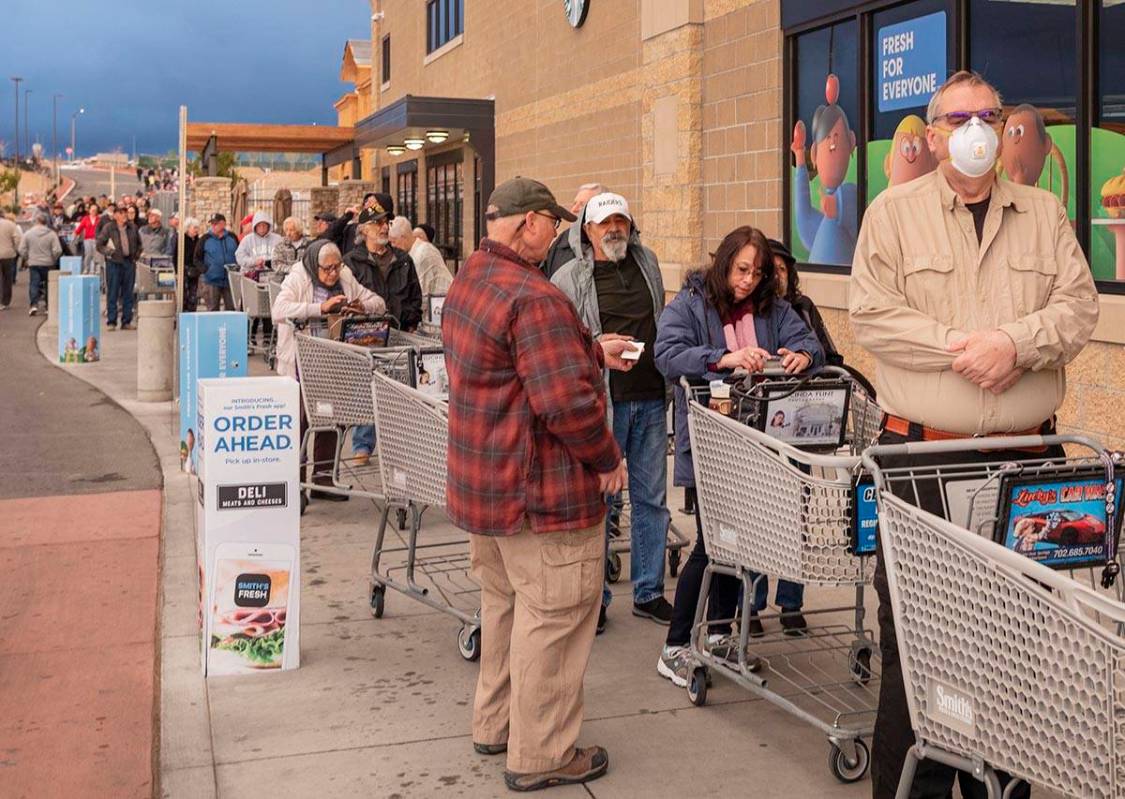 Seniors line up outside of a Smith's Marketplace located at 9710 West Skye Canyon Park Drive in ...