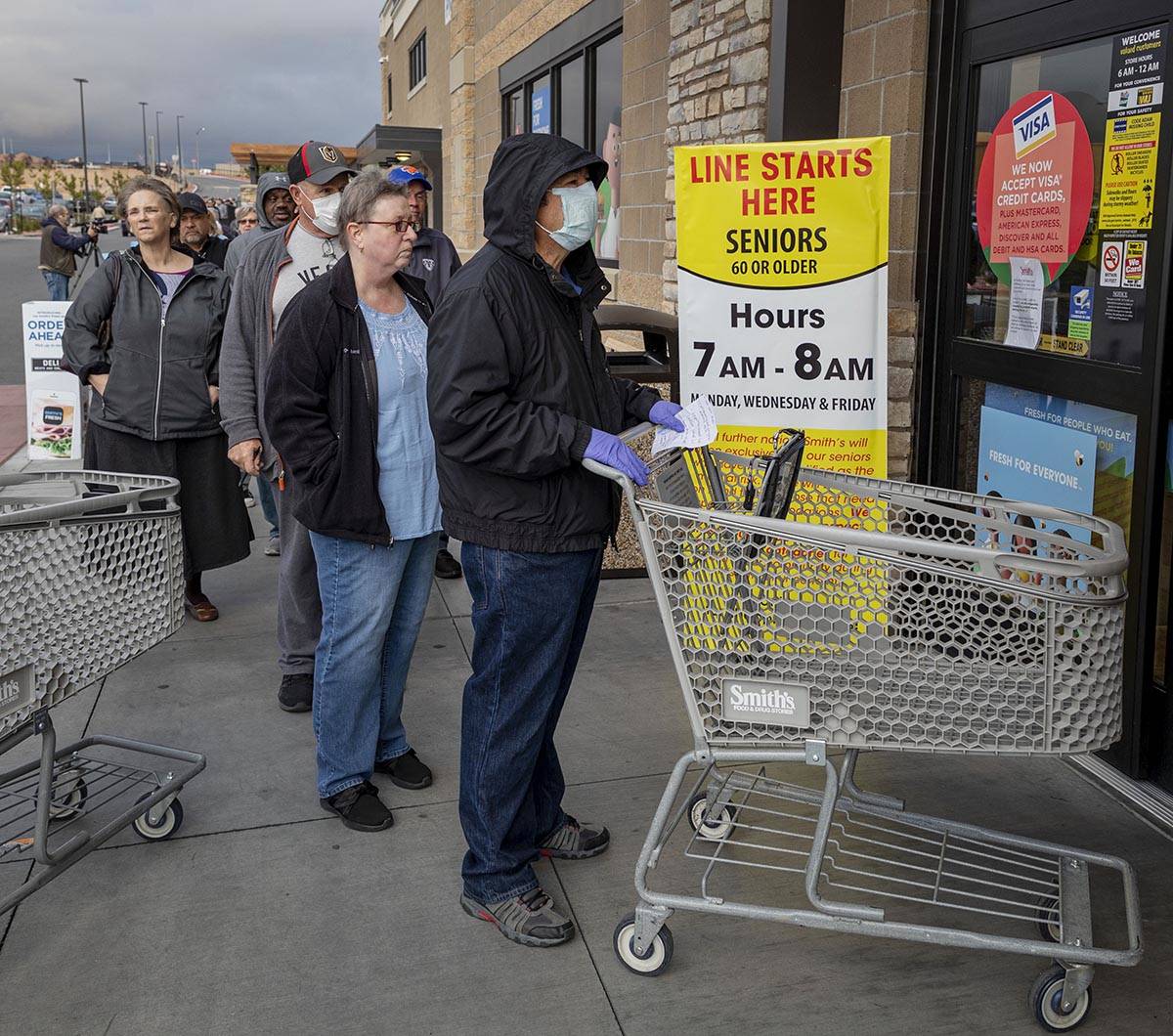 Seniors line up outside of a Smith's Marketplace located at 9710 West Skye Canyon Park Drive in ...