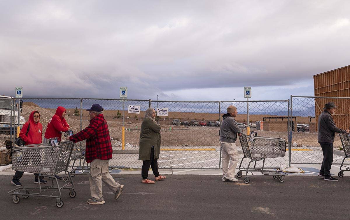 Seniors line up outside of a Smith's Marketplace located at 9710 West Skye Canyon Park Drive in ...