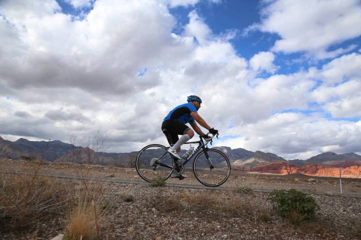 A cyclists makes his way north on Route 159 at Red Rock Canyon in Las Vegas, Saturday, March 21 ...