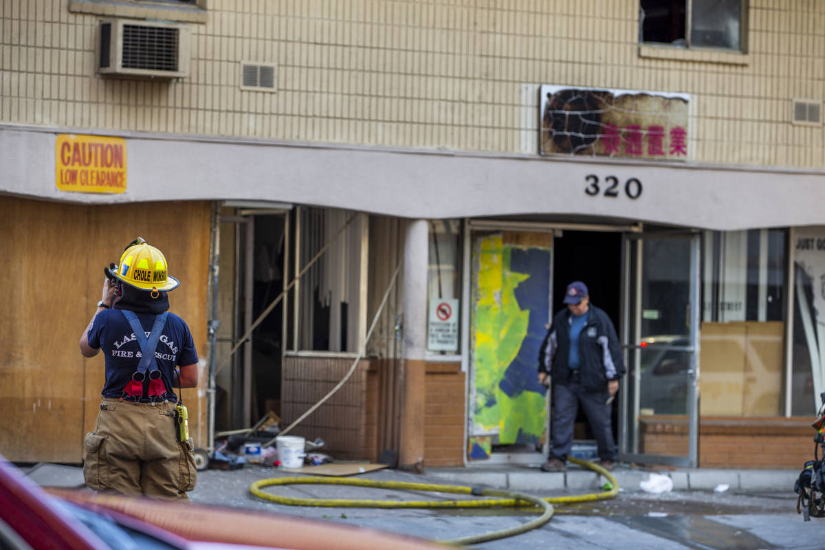 Las Vegas Fire Department personnel clear the building after a fire in a downtown Las Vegas vac ...