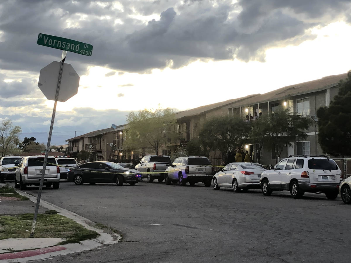 Police serve a warrant at a home on Corsaire Avenue near Vornsand Drive in Las Vegas on Saturda ...