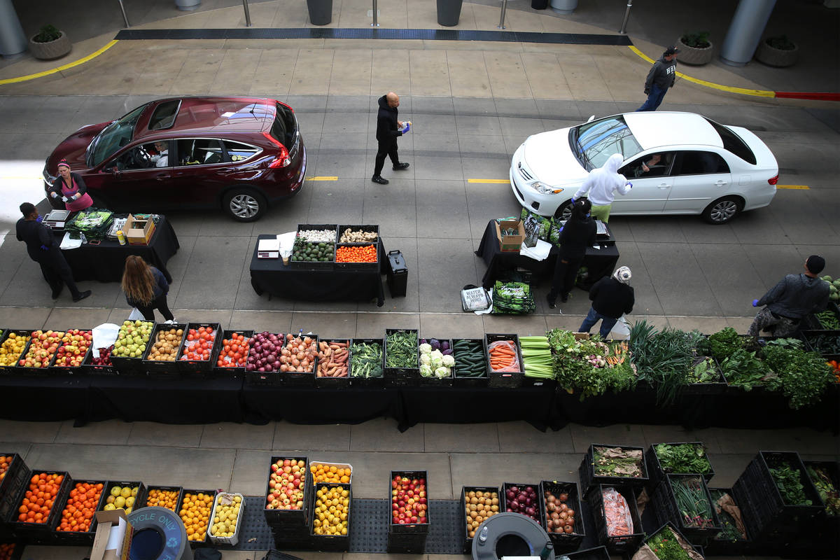 People line up at the Las Vegas Farmers Market drive-through in Downtown Summerlin in Las Vegas ...