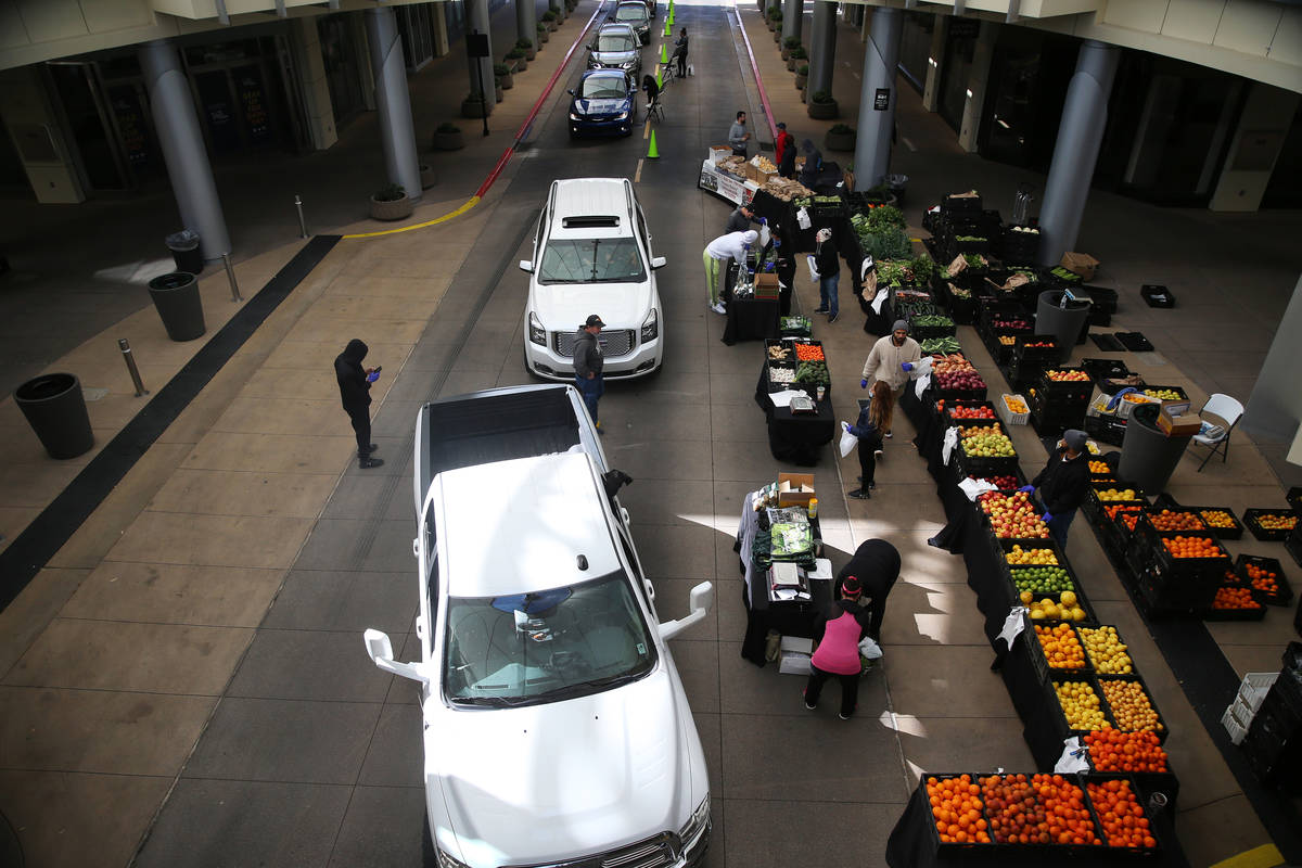 People line up at the Las Vegas Farmers Market drive-through in Downtown Summerlin in Las Vegas ...