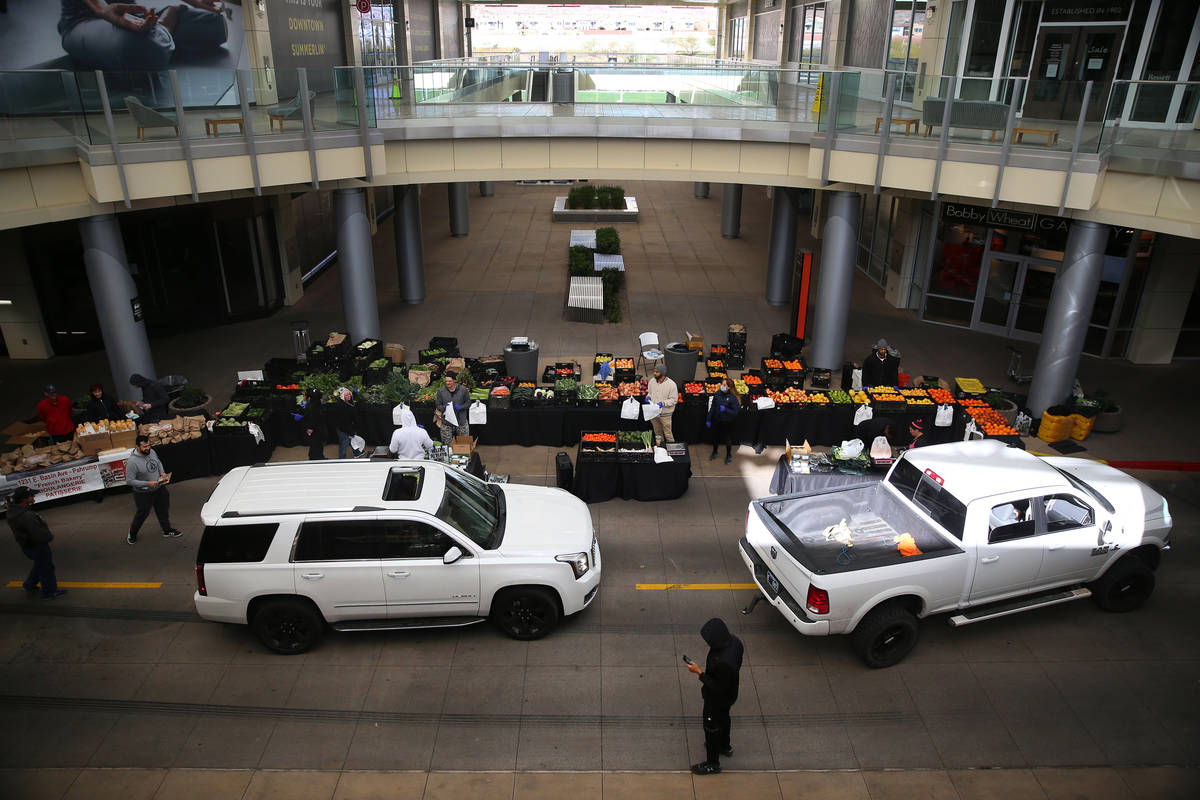 People line up at the Las Vegas Farmers Market drive-through in Downtown Summerlin in Las Vegas ...