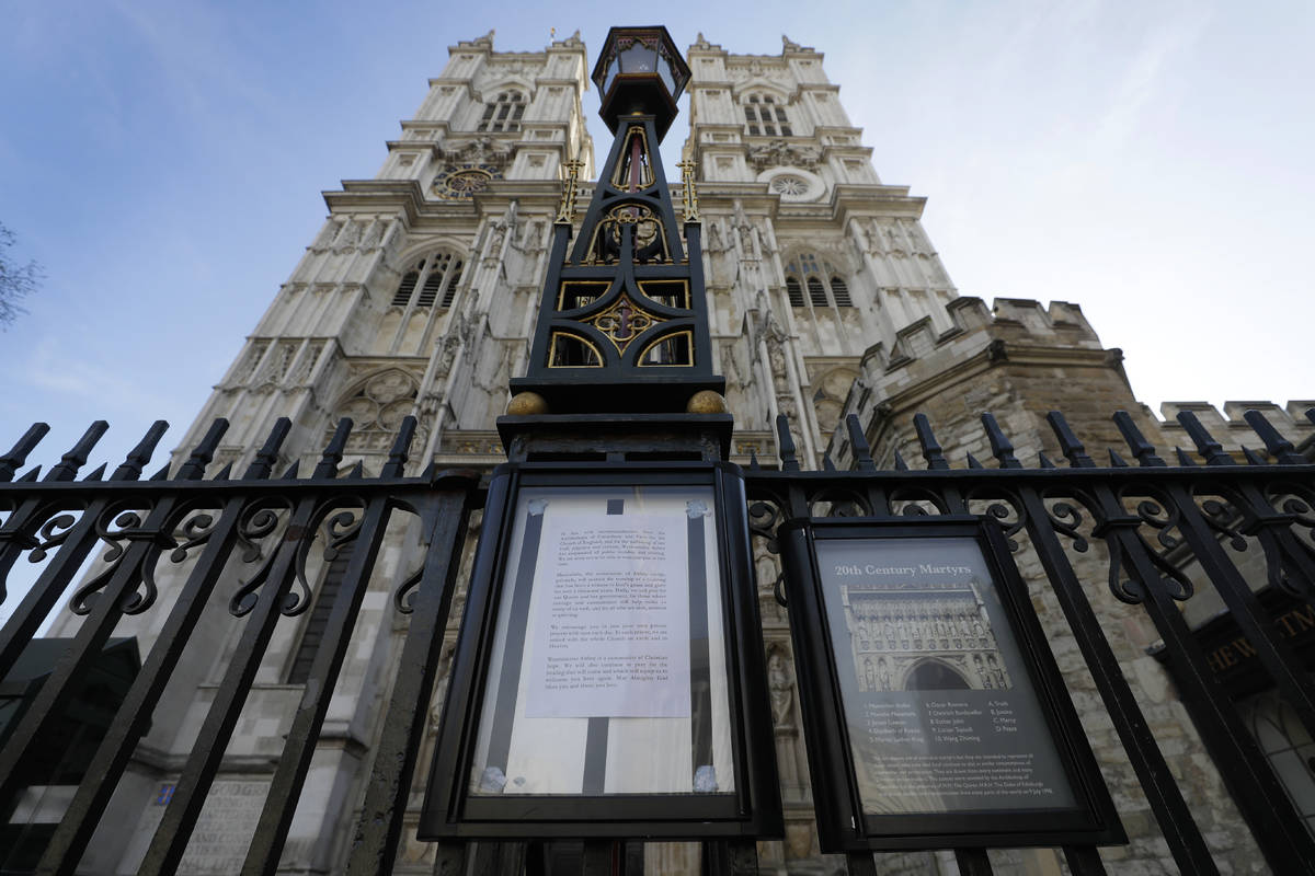 A notice on the gates of Westminster Abbey warning of its closure after places of worship were ...