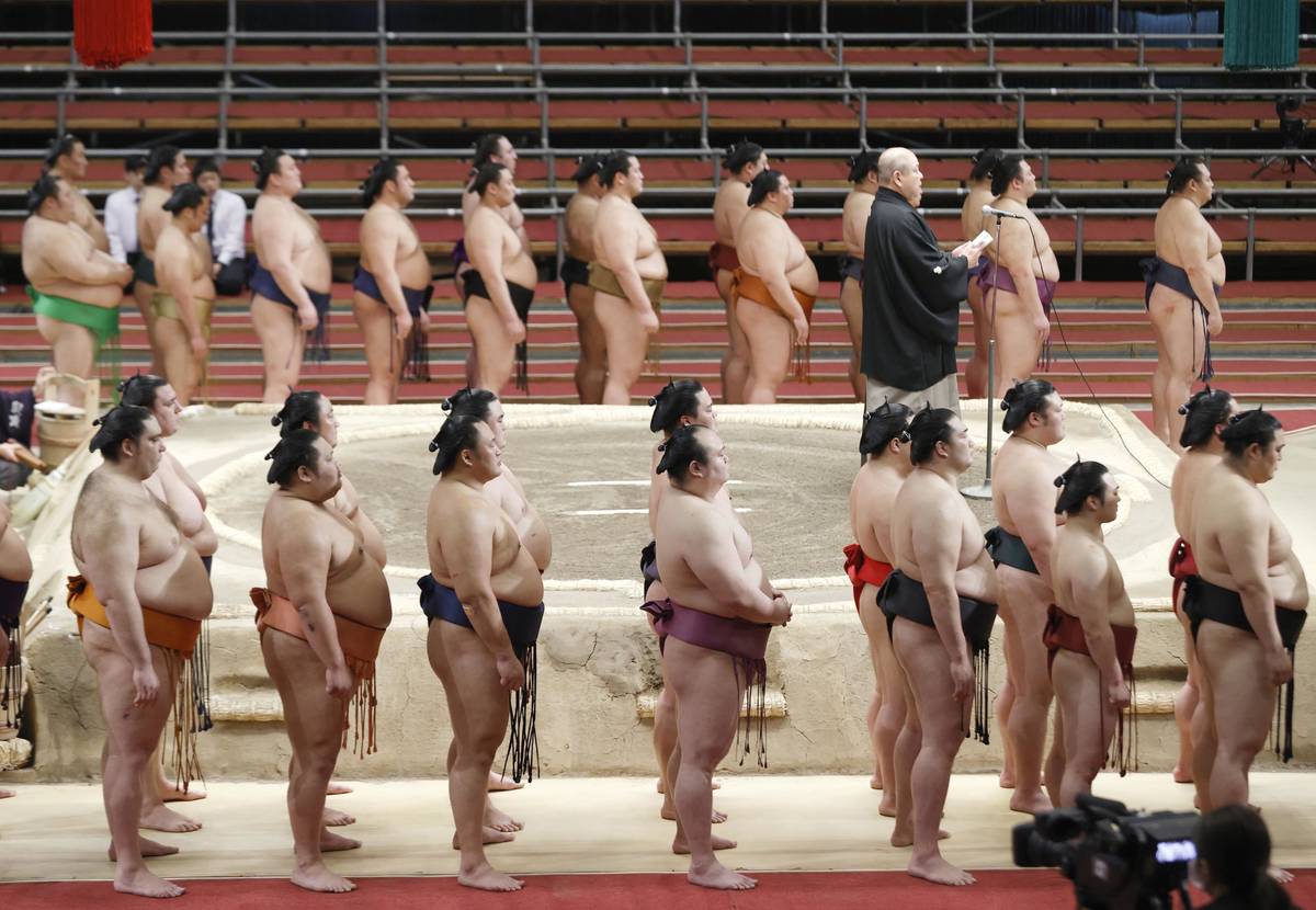 Japan Sumo Association Chairman Hakkaku (on the raised ring) delivers a speech in closing the S ...