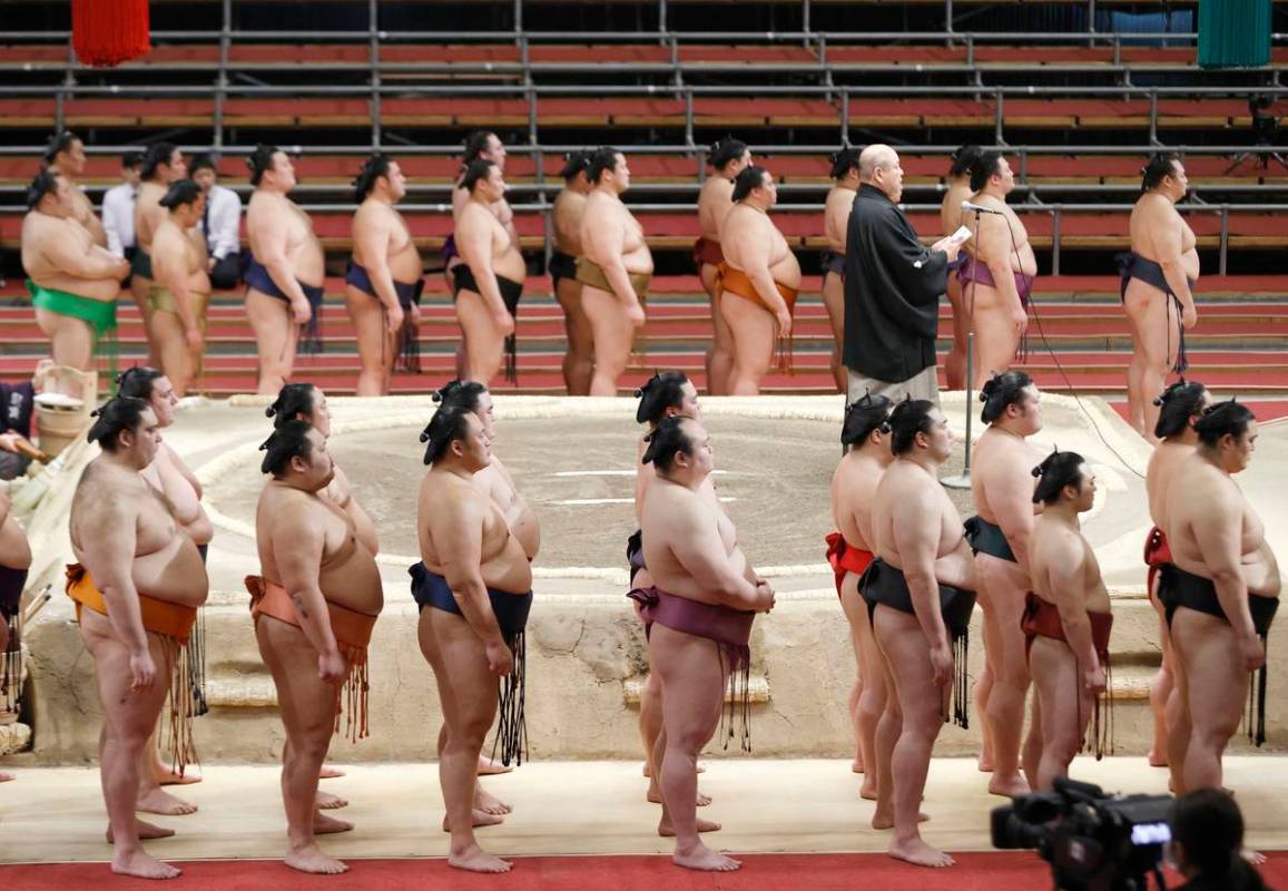 Japan Sumo Association Chairman Hakkaku (on the raised ring) delivers a speech in closing the S ...