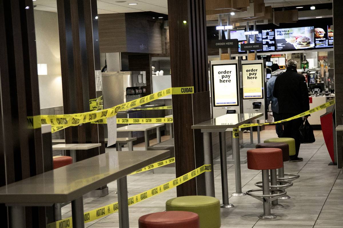 People stand in line for their order at a McDonald's restaurant in the Brooklyn borough of New ...