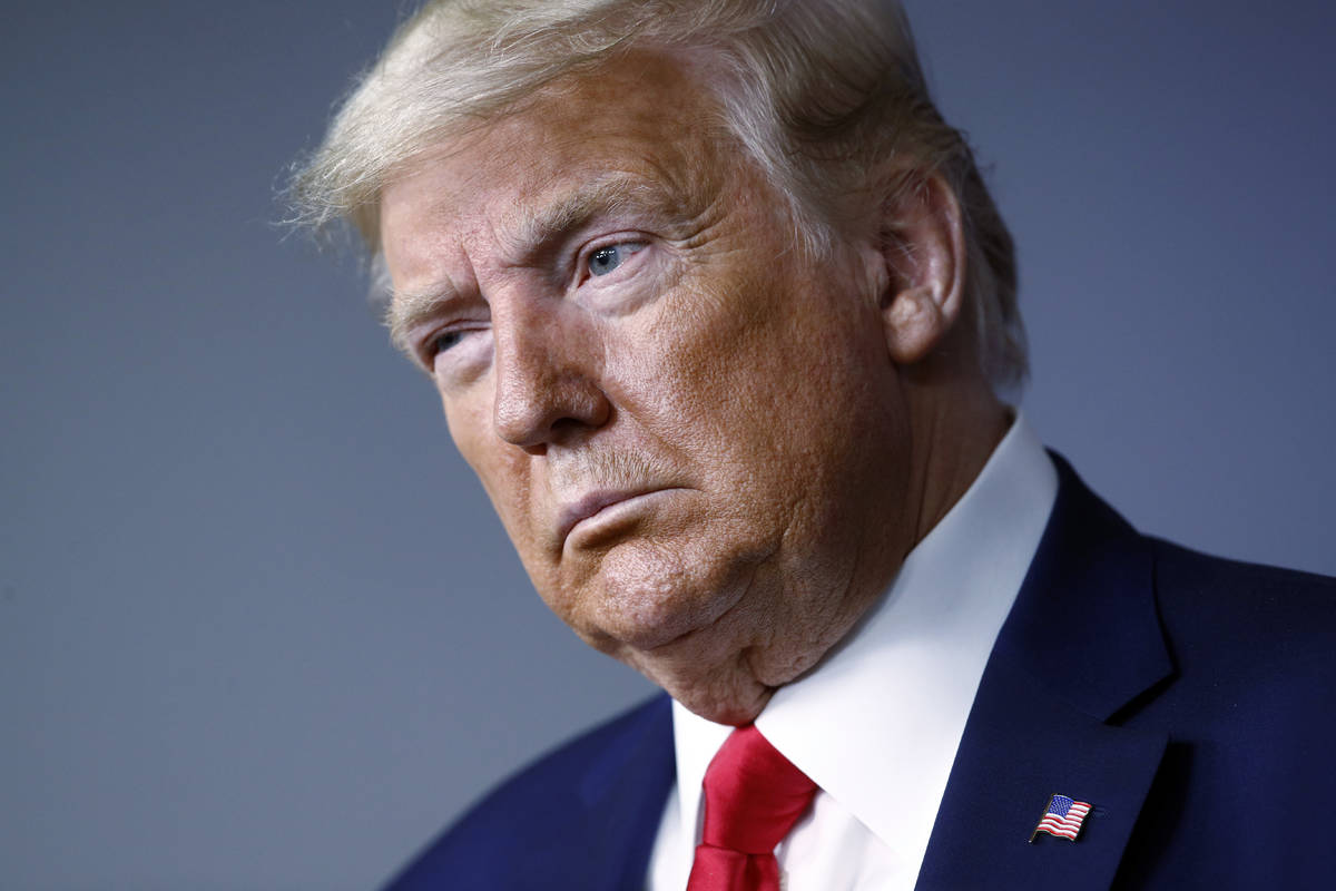 President Donald Trump listens during a coronavirus task force briefing at the White House, Sun ...