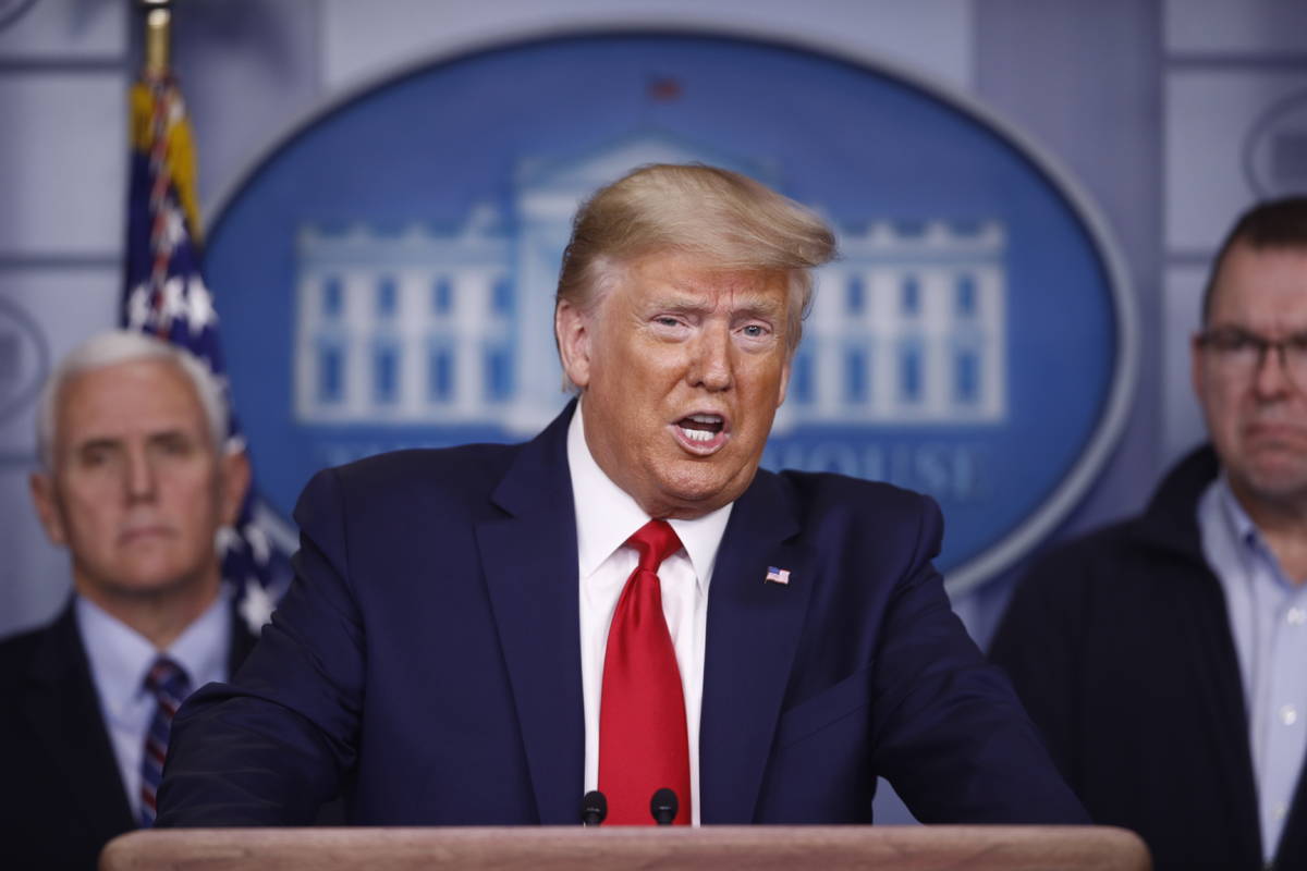 President Donald Trump speaks as Vice President Mike Pence, left, and FEMA Administrator Peter ...