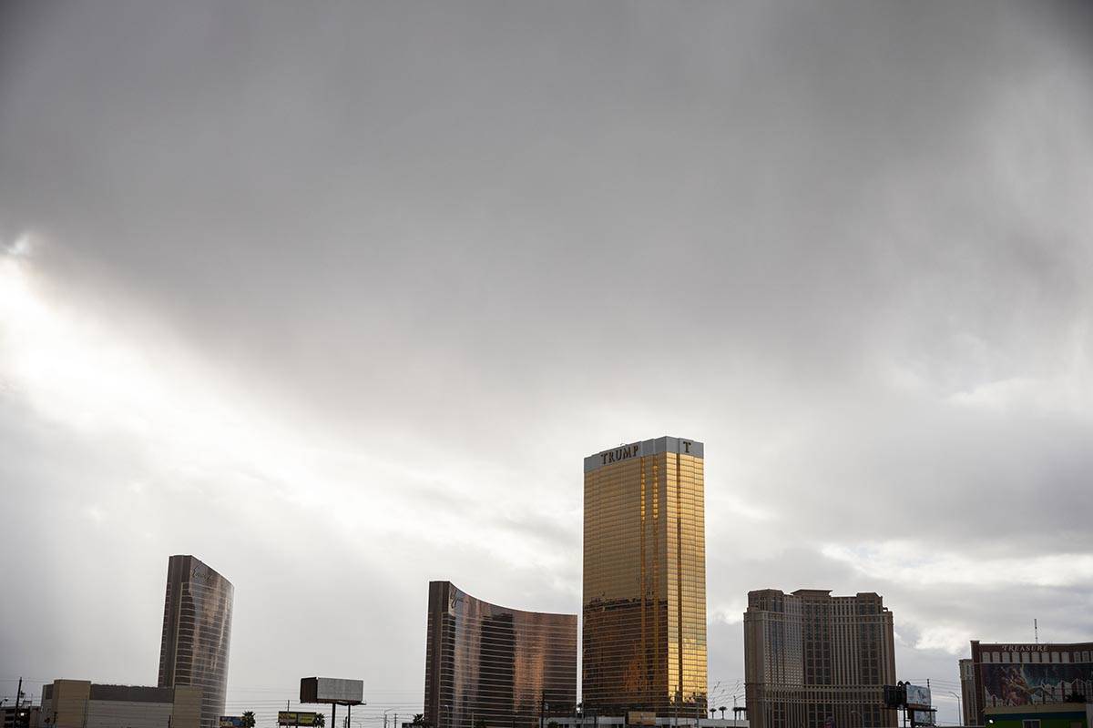 Dark clouds bring light rain over the Las Vegas Strip in Las Vegas on Monday, March 23, 2020. ( ...