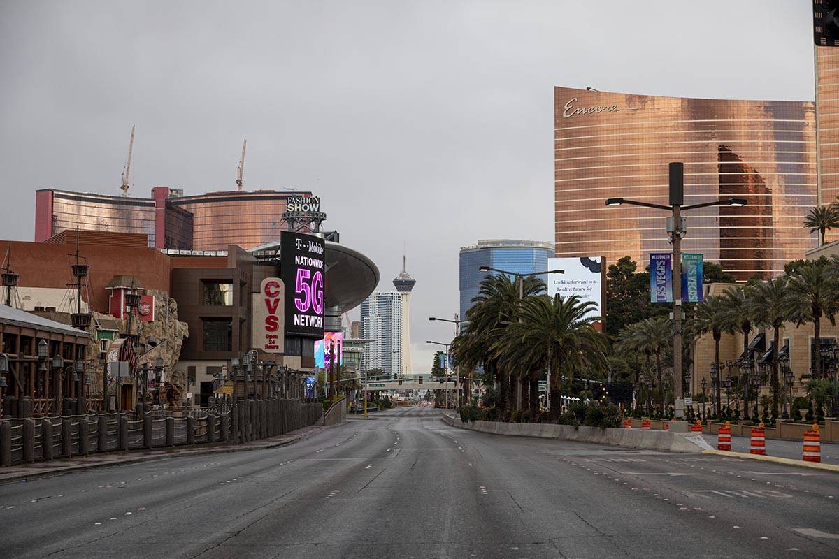 Dark clouds bring light rain over the Las Vegas Strip in Las Vegas on Monday, March 23, 2020. ( ...
