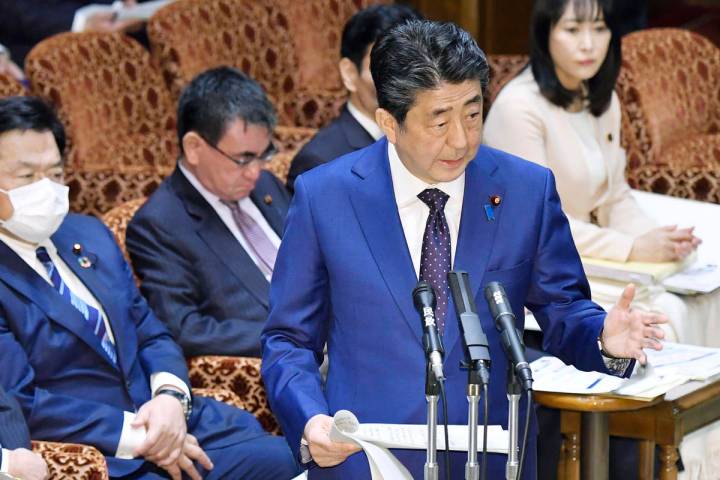 Japan’s Prime Minister Shinzo Abe speaks at a parliamentary session in Tokyo Monday, Mar ...